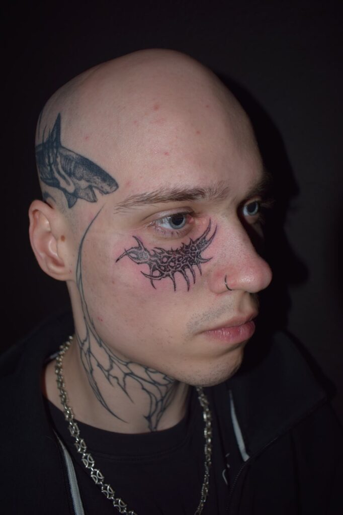 Freehand blackwork face tattoo