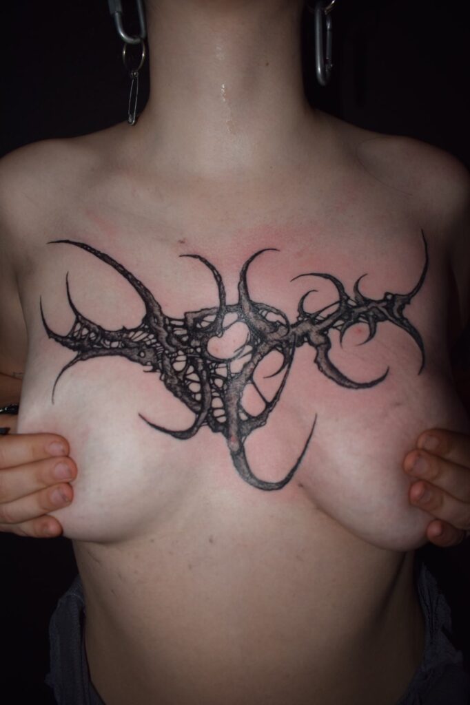 Freehand blackwork sternum piece